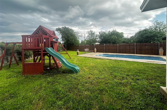 view of jungle gym with a fenced backyard, a fenced in pool, and a yard