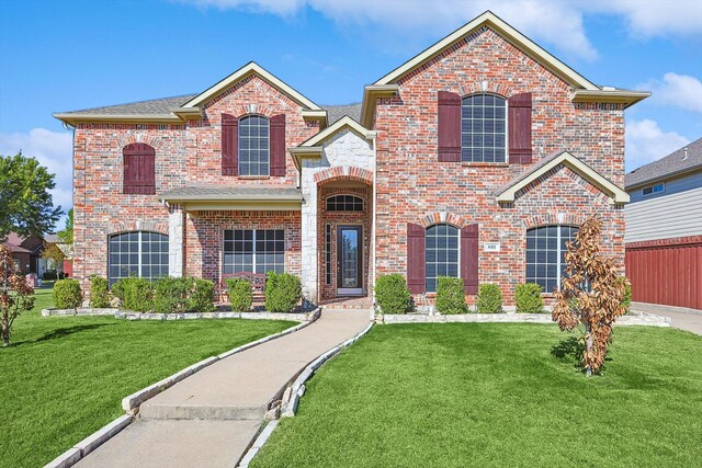 801 Hunters Gln, Murphy, TX 75094 - carpeted living area featuring a tray ceiling, ceiling fan, arched walkways, and a chandelier