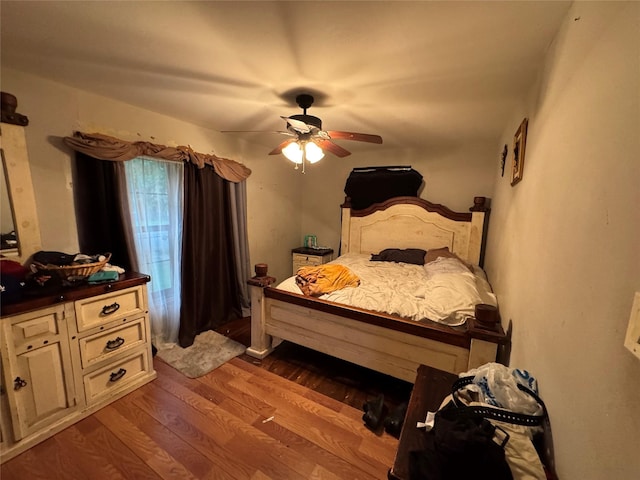 bedroom featuring a ceiling fan and wood finished floors