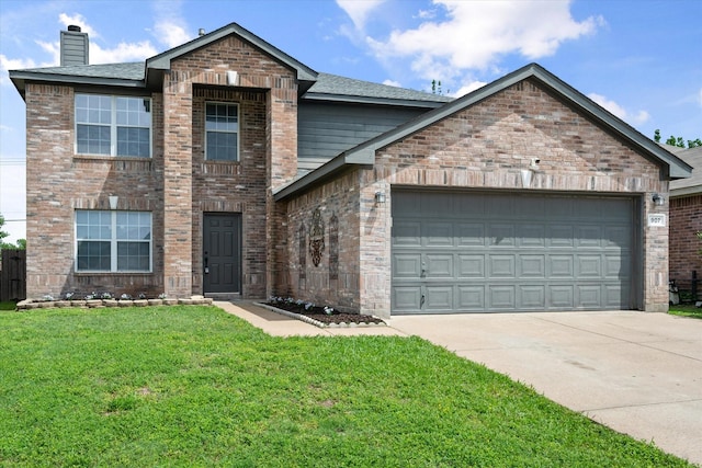 traditional-style house featuring a front yard, a chimney, brick siding, concrete driveway, and an attached garage