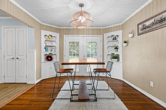 dining space with french doors, baseboards, ornamental molding, and built in features
