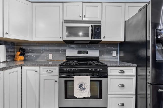 kitchen featuring white cabinets, stainless steel appliances, and tasteful backsplash