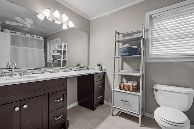 bathroom with vanity, a ceiling fan, crown molding, and toilet