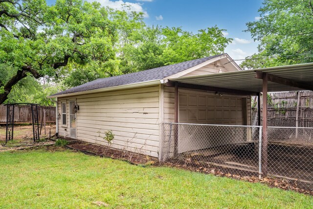 view of outbuilding with fence