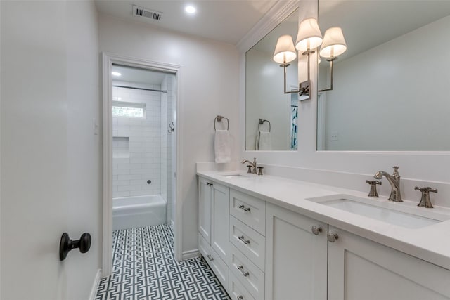 bathroom featuring visible vents, a sink, and baseboards