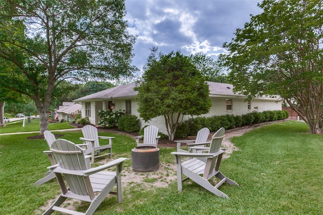view of yard with an outdoor fire pit