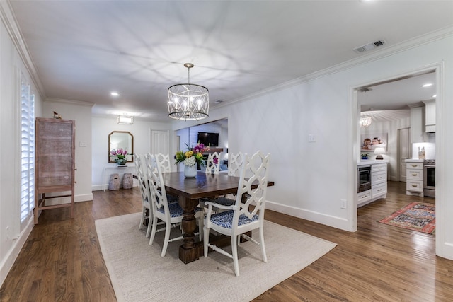dining room with baseboards, a notable chandelier, and ornamental molding