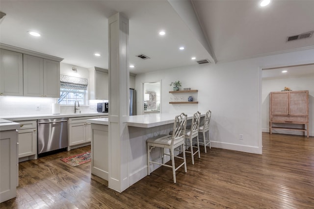 kitchen featuring stainless steel appliances, visible vents, and a sink