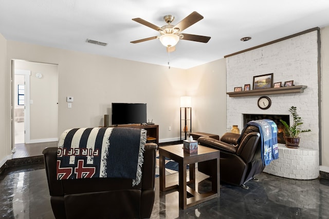 living area with a brick fireplace, ceiling fan, visible vents, and baseboards