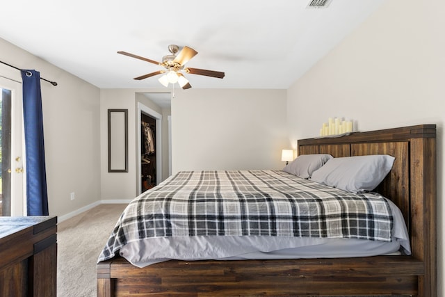 bedroom featuring a ceiling fan, baseboards, visible vents, and light carpet