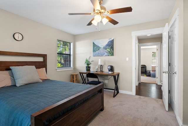 carpeted bedroom featuring baseboards and ceiling fan
