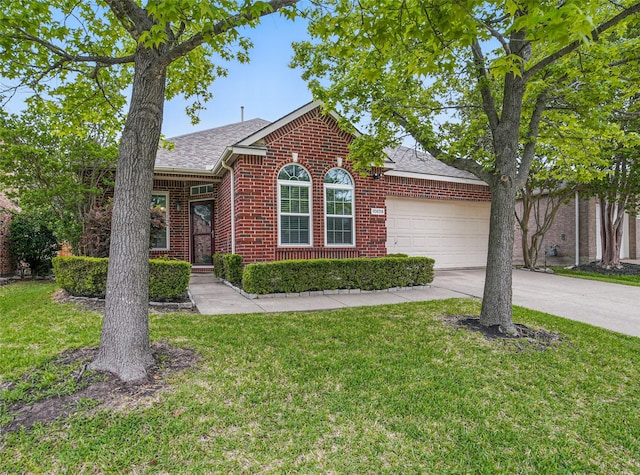ranch-style home with a front yard, a garage, brick siding, concrete driveway, and a shingled roof