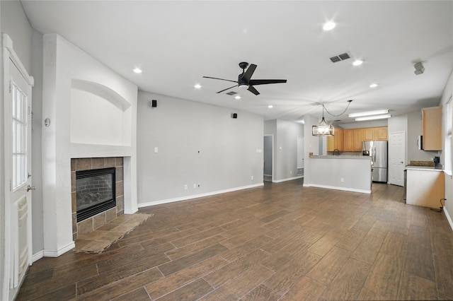 unfurnished living room with visible vents, recessed lighting, ceiling fan, and a fireplace