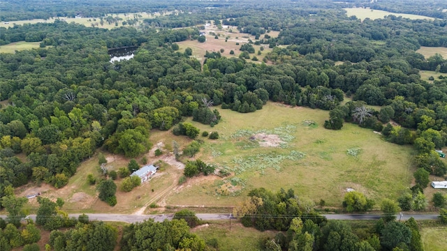 drone / aerial view with a rural view and a wooded view