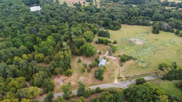 aerial view with a rural view and a wooded view