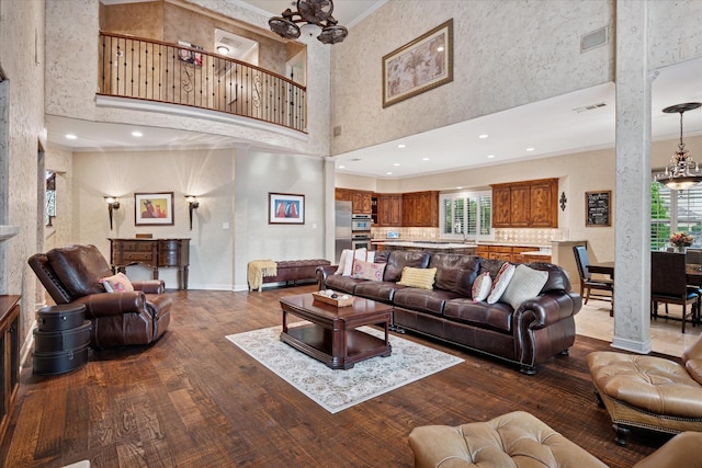 400 Indian Paintbrush Way, Southlake, TX 76092 - living area featuring crown molding, a high ceiling, dark wood finished floors, and a wealth of natural light