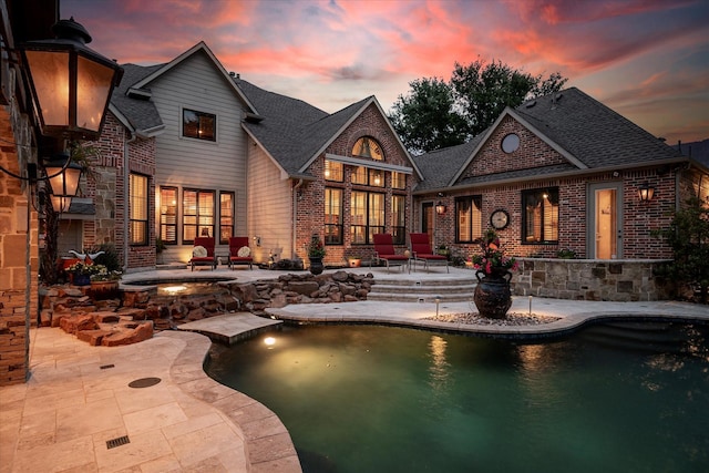 400 Indian Paintbrush Way, Southlake, TX 76092 - back of property with roof with shingles, a patio area, an outdoor pool, and brick siding