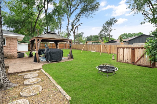 2009 Greenbriar Ln, Plano, TX 75074 - view of yard with a gazebo, a fire pit, a patio, a shed, and an outdoor structure