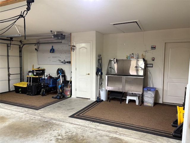 garage featuring a garage door opener