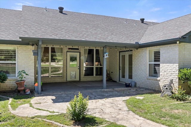 6510 Circo Dr, Granbury, TX 76049 - rear view of property with roof with shingles, brick siding, and a patio area