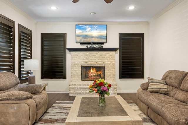 6510 Circo Dr, Granbury, TX 76049 - living room with wood finished floors, a fireplace, ornamental molding, a ceiling fan, and baseboards