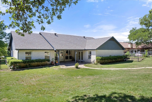 6510 Circo Dr, Granbury, TX 76049 - back of property featuring brick siding, roof with shingles, and a patio area