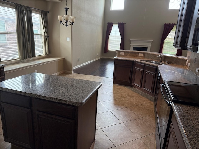1121 Albany Dr, Fort Worth, TX 76131 - kitchen featuring an inviting chandelier, a sink, a healthy amount of sunlight, and open floor plan