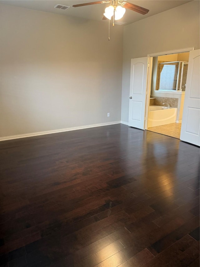 1121 Albany Dr, Fort Worth, TX 76131 - unfurnished room with ceiling fan, visible vents, baseboards, and dark wood-type flooring