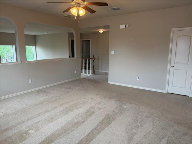 1121 Albany Dr, Fort Worth, TX 76131 - carpeted spare room with arched walkways, baseboards, a ceiling fan, and visible vents