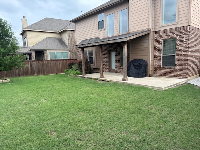 1121 Albany Dr, Fort Worth, TX 76131 - back of house with brick siding, a patio area, fence, and a yard