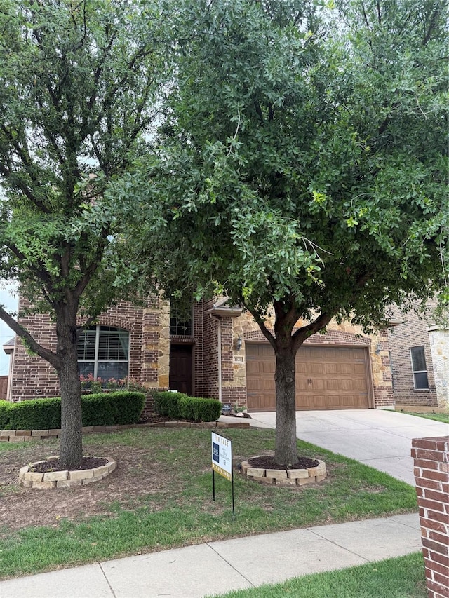 1121 Albany Dr, Fort Worth, TX 76131 - obstructed view of property featuring brick siding and concrete driveway