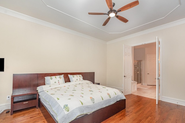 bedroom featuring crown molding, a ceiling fan, and wood finished floors