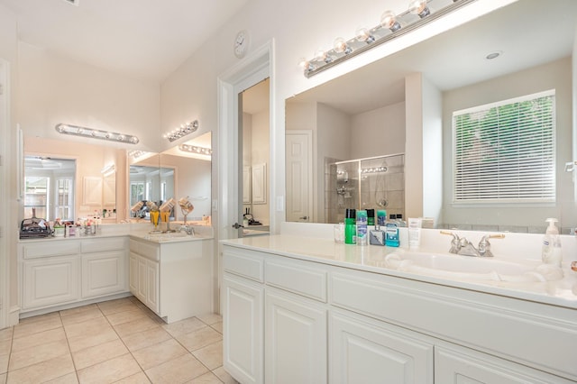 full bathroom featuring tile patterned floors, a shower stall, and vanity