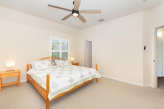 bedroom featuring baseboards, light colored carpet, ceiling fan, and visible vents