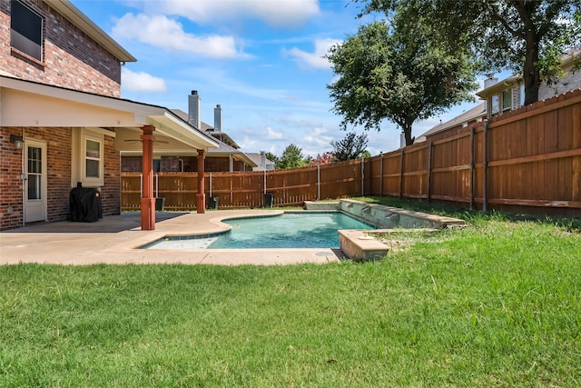 view of swimming pool featuring a fenced backyard, a fenced in pool, a yard, and a patio