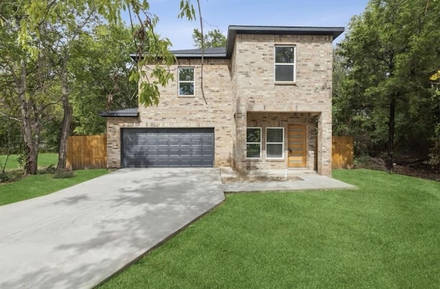view of front facade with a garage, concrete driveway, a front lawn, and brick siding