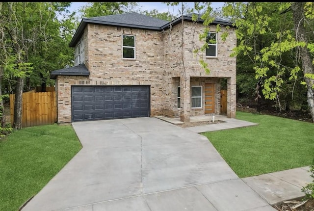 view of front of house with brick siding, a garage, a front lawn, and fence
