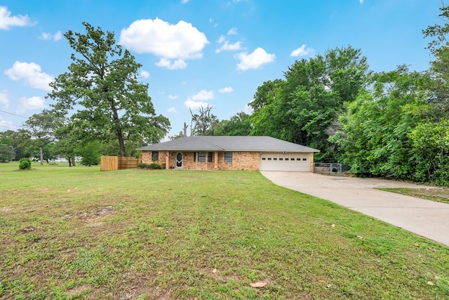 ranch-style home with concrete driveway, fence, a front lawn, and a garage