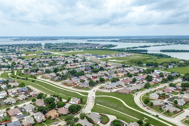 drone / aerial view with a residential view and a water view
