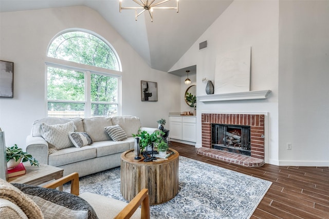 living area with a fireplace, high vaulted ceiling, baseboards, visible vents, and dark wood-style floors