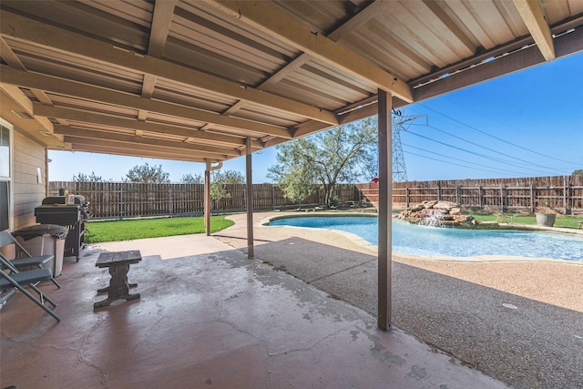 view of pool featuring a fenced in pool, a fenced backyard, and a patio area