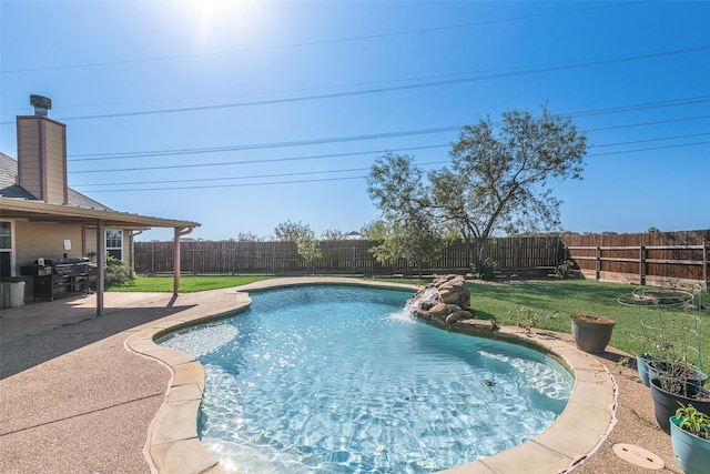 view of swimming pool with a yard, a patio, a fenced in pool, and a fenced backyard
