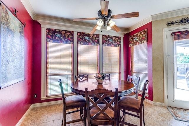 dining space featuring light tile patterned floors, baseboards, ceiling fan, and crown molding