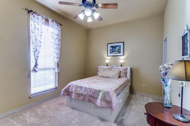 bedroom with carpet floors, ceiling fan, and baseboards