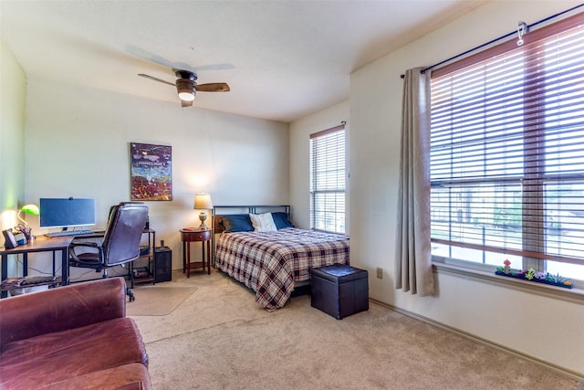 carpeted bedroom with baseboards and ceiling fan