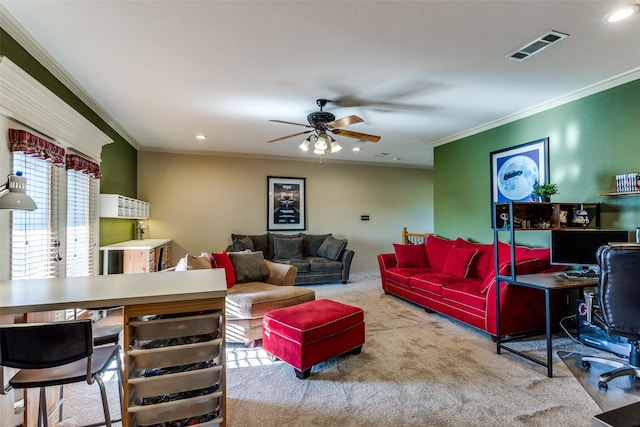 carpeted living area with visible vents, ornamental molding, ceiling fan, and recessed lighting