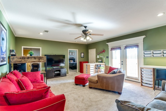 carpeted living area featuring crown molding, ceiling fan, french doors, recessed lighting, and visible vents