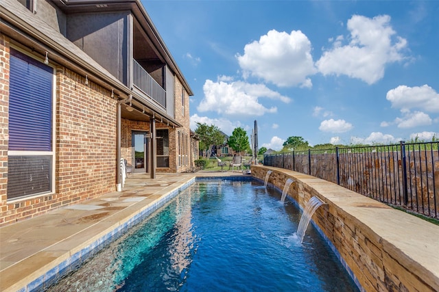view of swimming pool with fence, a fenced in pool, and a patio