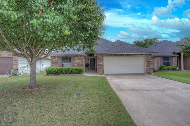 ranch-style house with brick siding, an attached garage, and roof with shingles