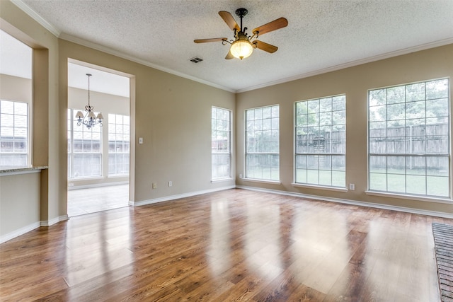 2310 Crest Park Dr, Arlington, TX 76006 - spare room with a healthy amount of sunlight, baseboards, ornamental molding, and visible vents